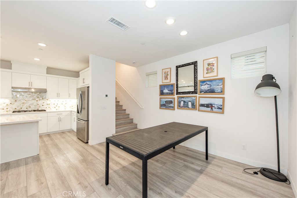 163 Restore Irvine, CA 92618 - Photo 8 of 45 a view of a kitchen and wooden floor and a window
