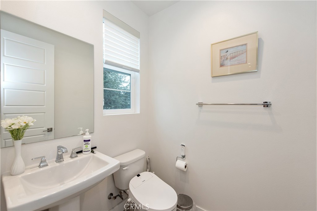 163 Restore Irvine, CA 92618 - Photo 9 of 45 a bathroom with a toilet sink and mirror
