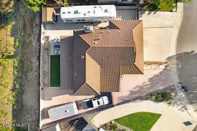 an aerial view of a house with outdoor space