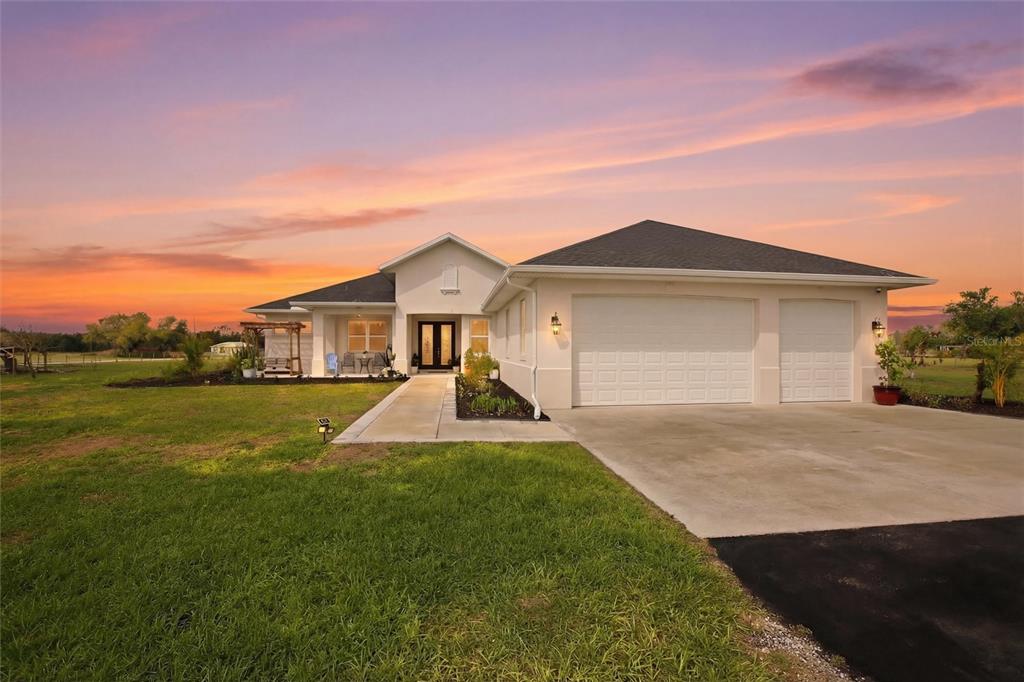 10080 Wauchula Road Myakka City, FL 34251 - Photo 1 of 55 a front view of a house with yard