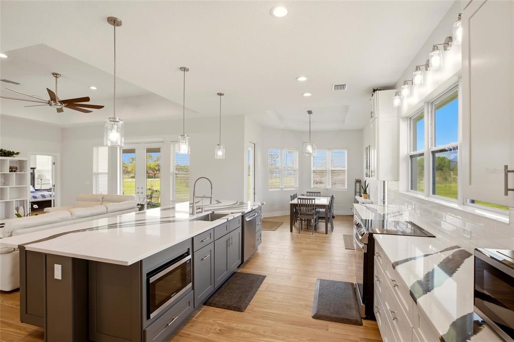 10080 Wauchula Road Myakka City, FL 34251 - Photo 14 of 55 a open kitchen with stainless steel appliances granite countertop a lot of counter space and a sink