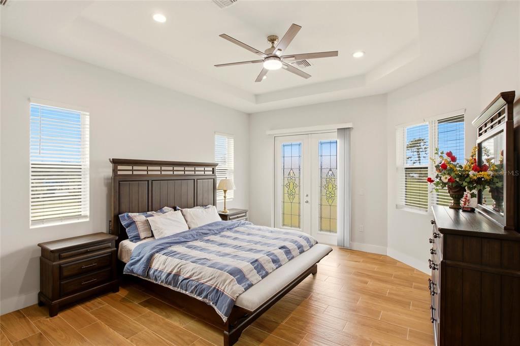 10080 Wauchula Road Myakka City, FL 34251 - Photo 18 of 55 a bedroom with a large bed and a window