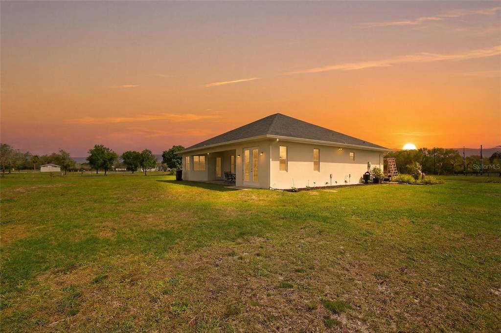 10080 Wauchula Road Myakka City, FL 34251 - Photo 2 of 55 a front view of a house with a yard