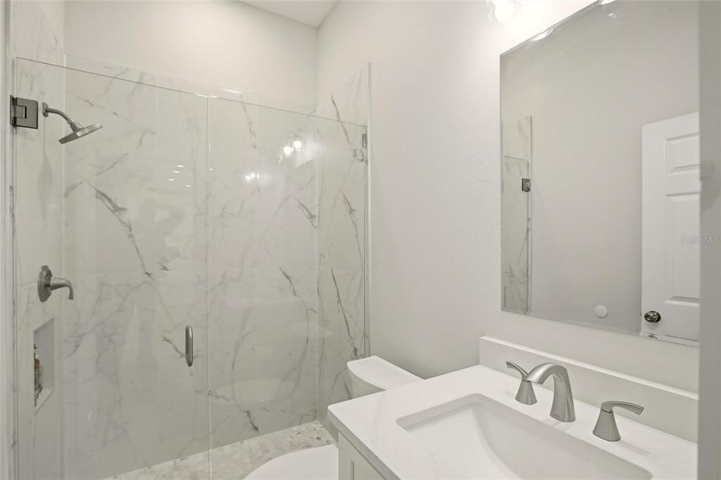 10080 Wauchula Road Myakka City, FL 34251 - Photo 29 of 55 a bathroom with a sink toilet and shower