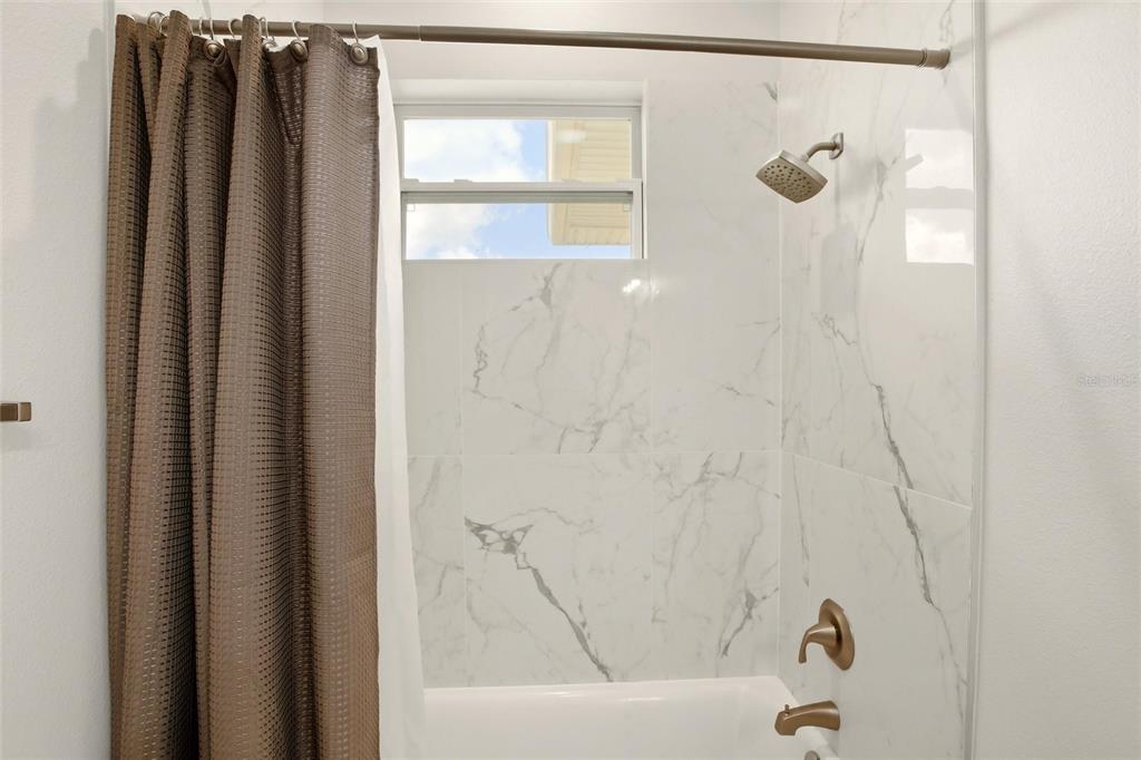 10080 Wauchula Road Myakka City, FL 34251 - Photo 35 of 55 a bathroom with a shower and a tub