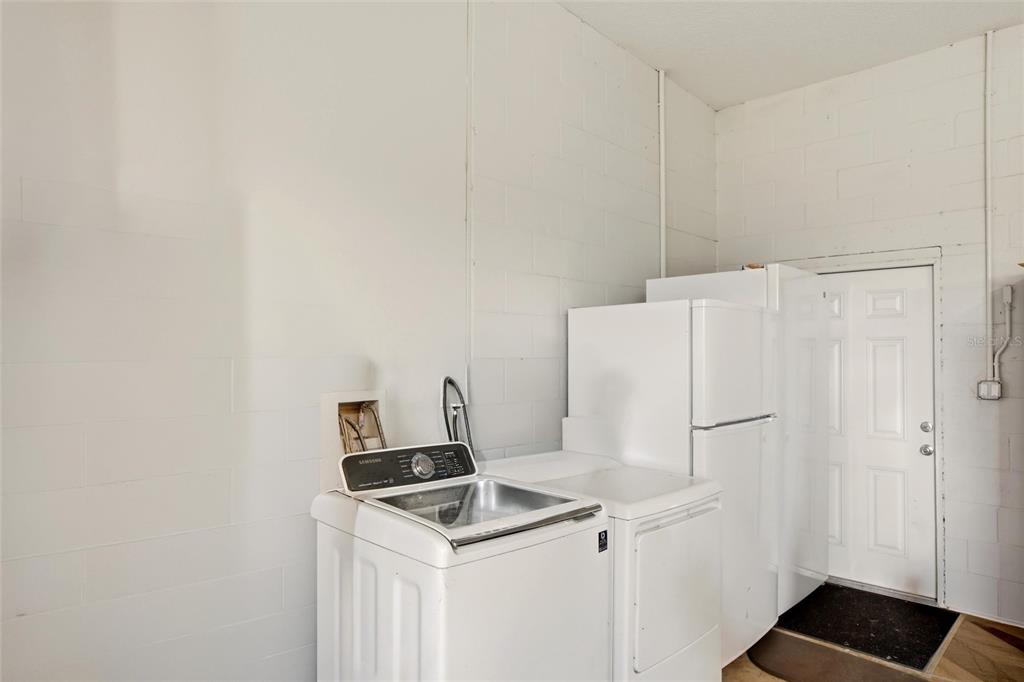 10080 Wauchula Road Myakka City, FL 34251 - Photo 40 of 55 a white refrigerator freezer sitting inside of a kitchen