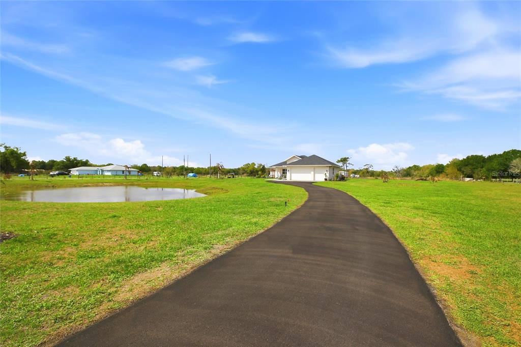 10080 Wauchula Road Myakka City, FL 34251 - Photo 4 of 55 a view of a lake with a big yard
