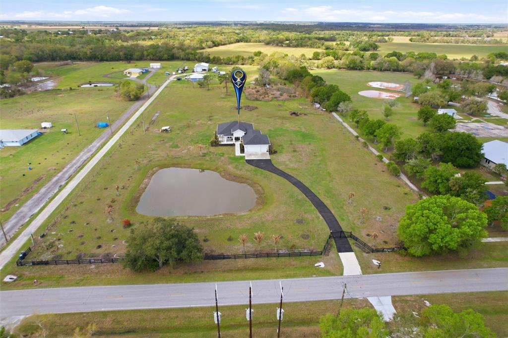 10080 Wauchula Road Myakka City, FL 34251 - Photo 52 of 55 a view of a swimming pool with a yard