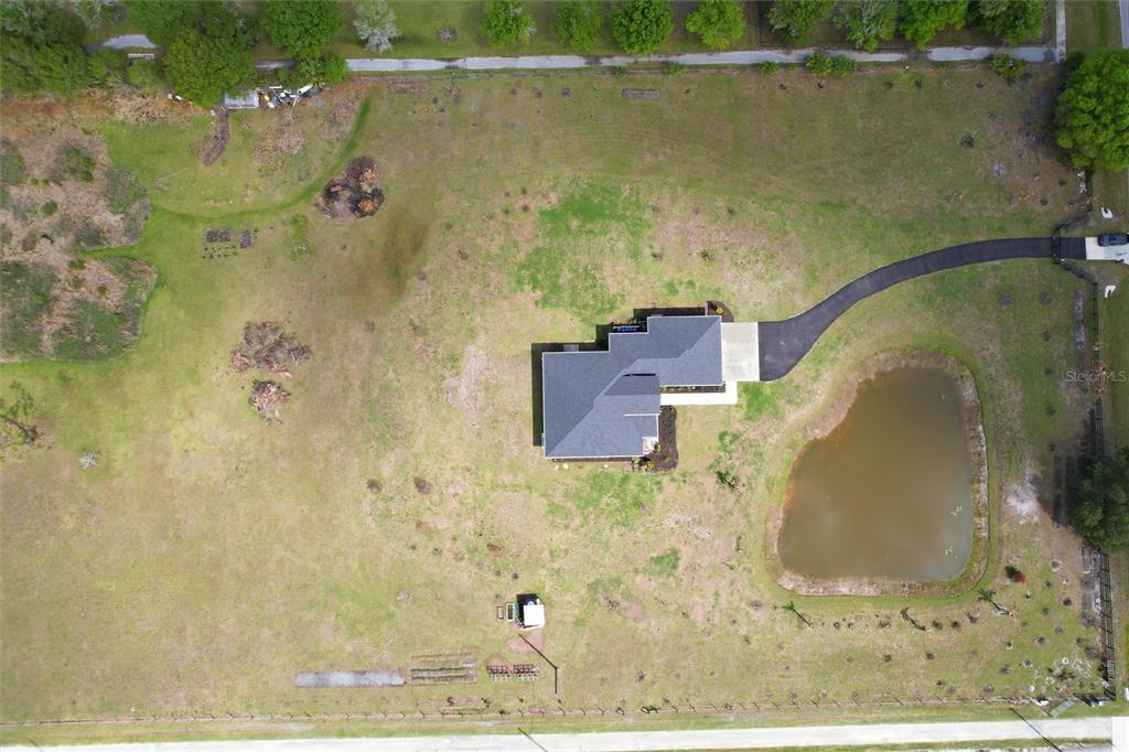 10080 Wauchula Road Myakka City, FL 34251 - Photo 54 of 55 an aerial view of a residential houses with outdoor space