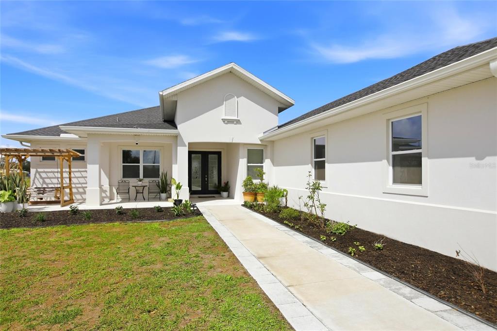 10080 Wauchula Road Myakka City, FL 34251 - Photo 6 of 55 a front view of a house with a yard