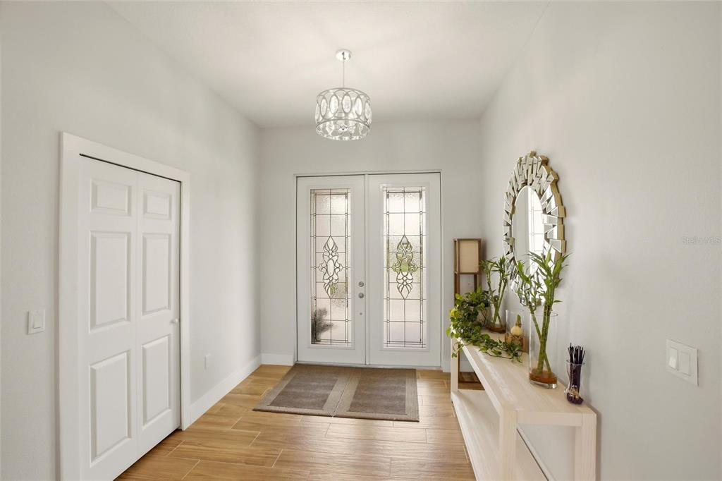 10080 Wauchula Road Myakka City, FL 34251 - Photo 7 of 55 a view of an entryway with wooden floor