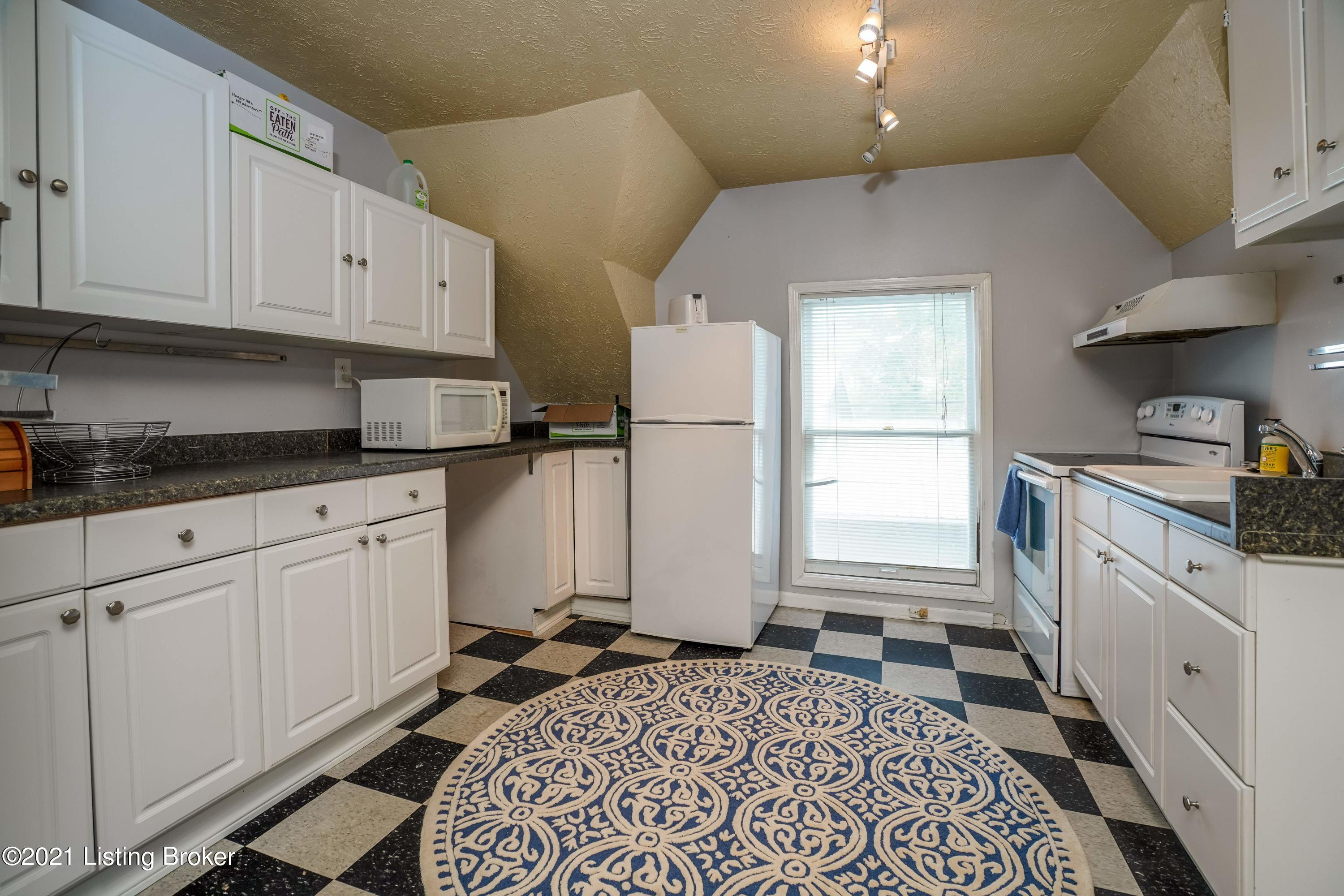 1279 Cherokee Road Louisville, KY 40204 - Photo 45 of 52 The carriage house kitchen is equipped for a tenant or guest to make meals.
