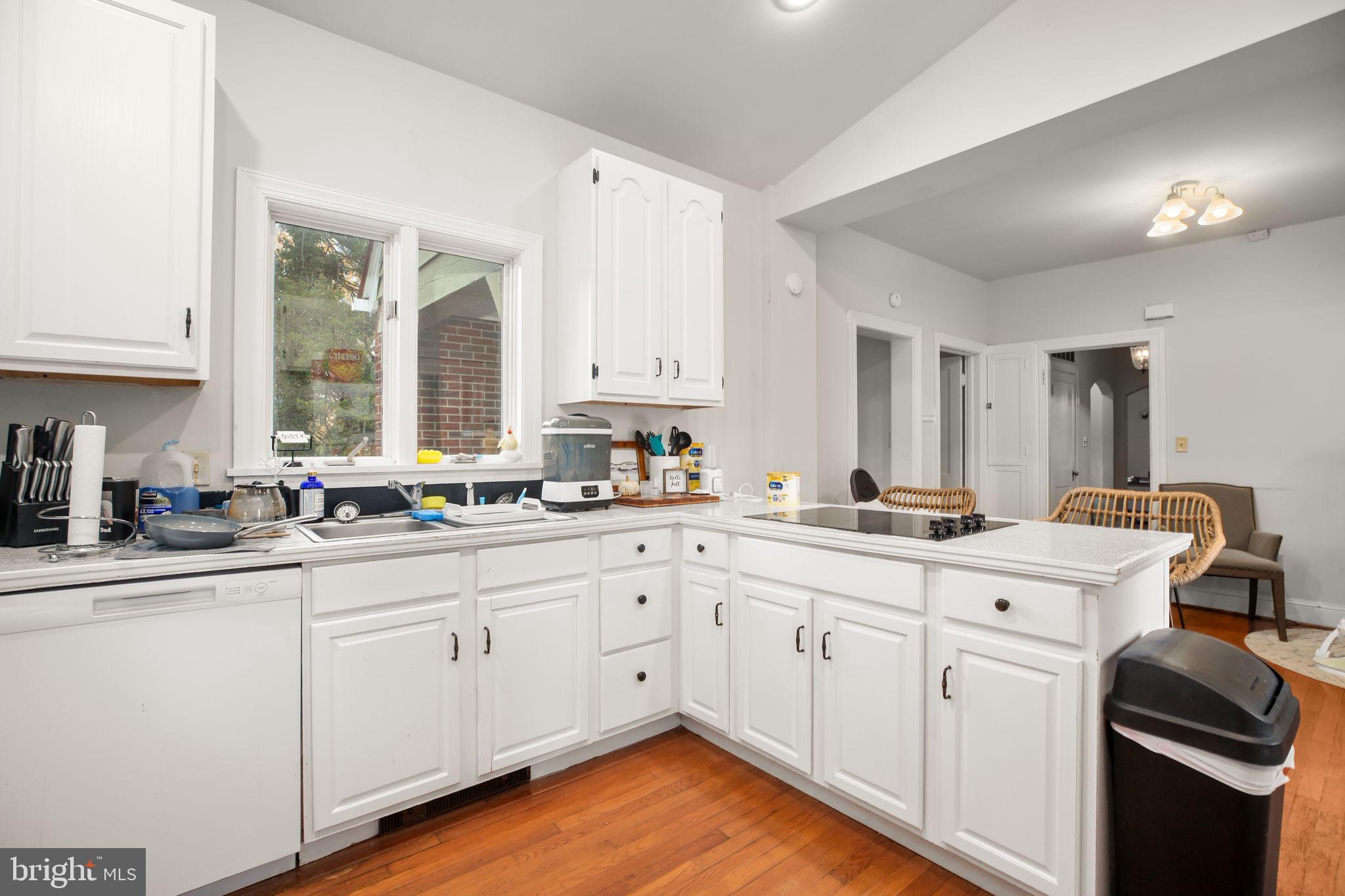 1717 Highland Road Fredericksburg, VA 22401 - Photo 2 of 40 a kitchen with white cabinets sink and white appliances