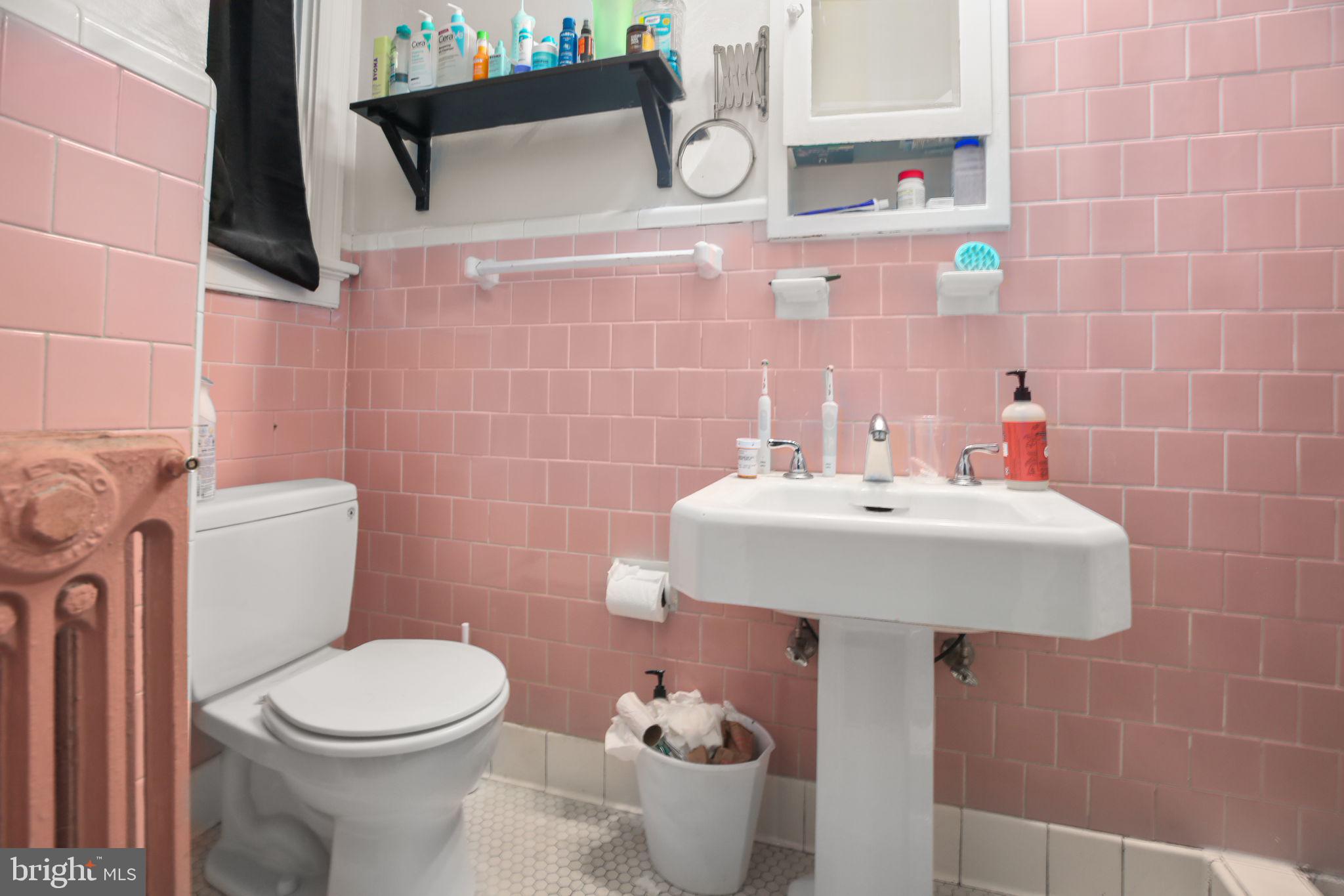 1717 Highland Road Fredericksburg, VA 22401 - Photo 25 of 40 a bathroom with a sink a toilet and mirror