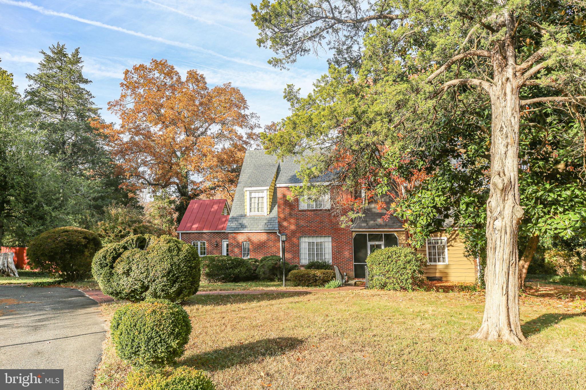 1717 Highland Road Fredericksburg, VA 22401 - Photo 27 of 40 a front view of a house with a yard and garage
