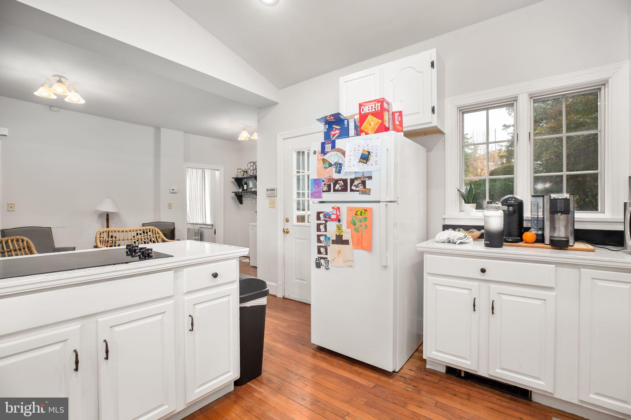 1717 Highland Road Fredericksburg, VA 22401 - Photo 3 of 40 a white kitchen with sink and refrigerator