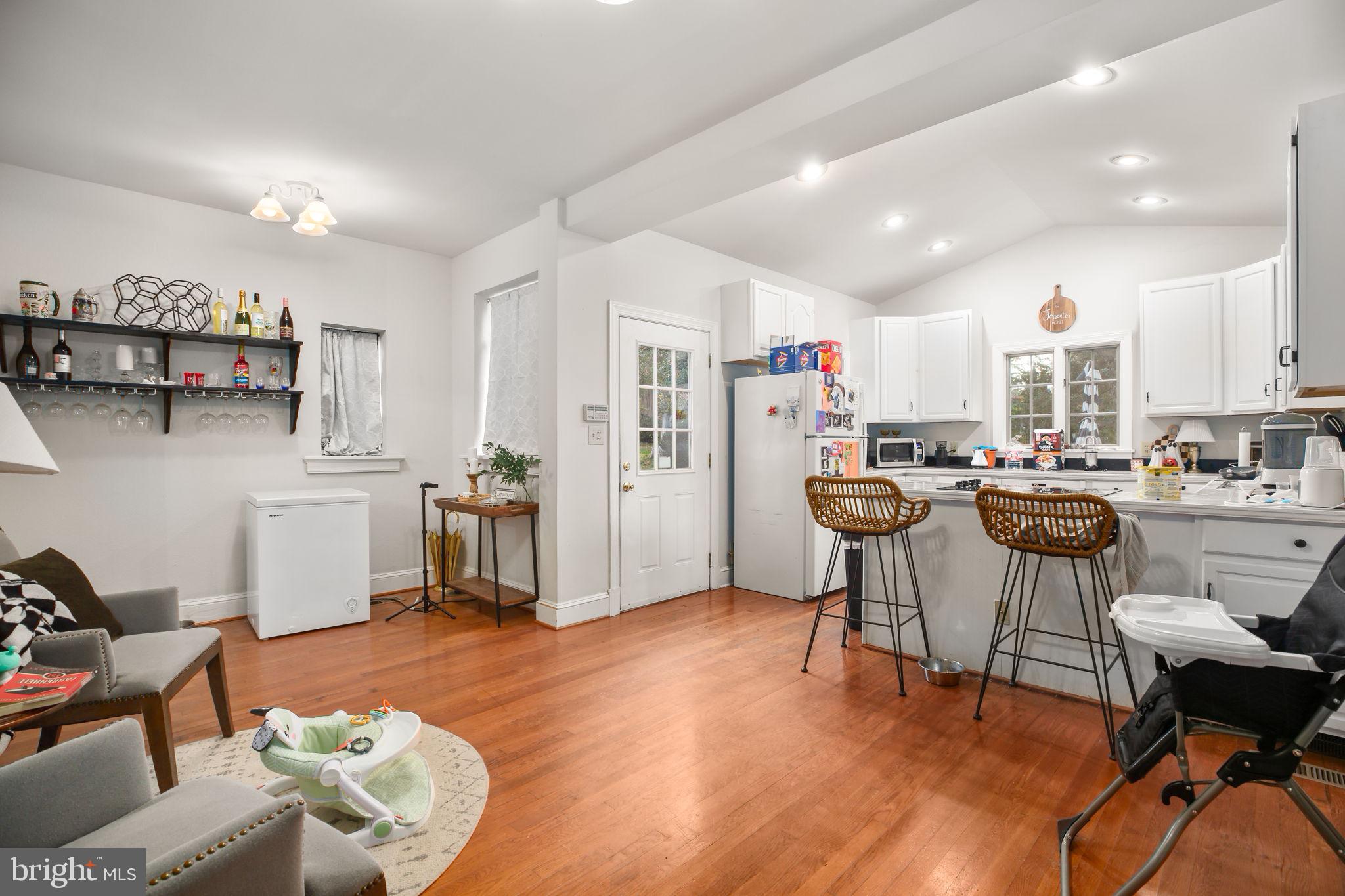 1717 Highland Road Fredericksburg, VA 22401 - Photo 7 of 40 a living room with furniture and kitchen view