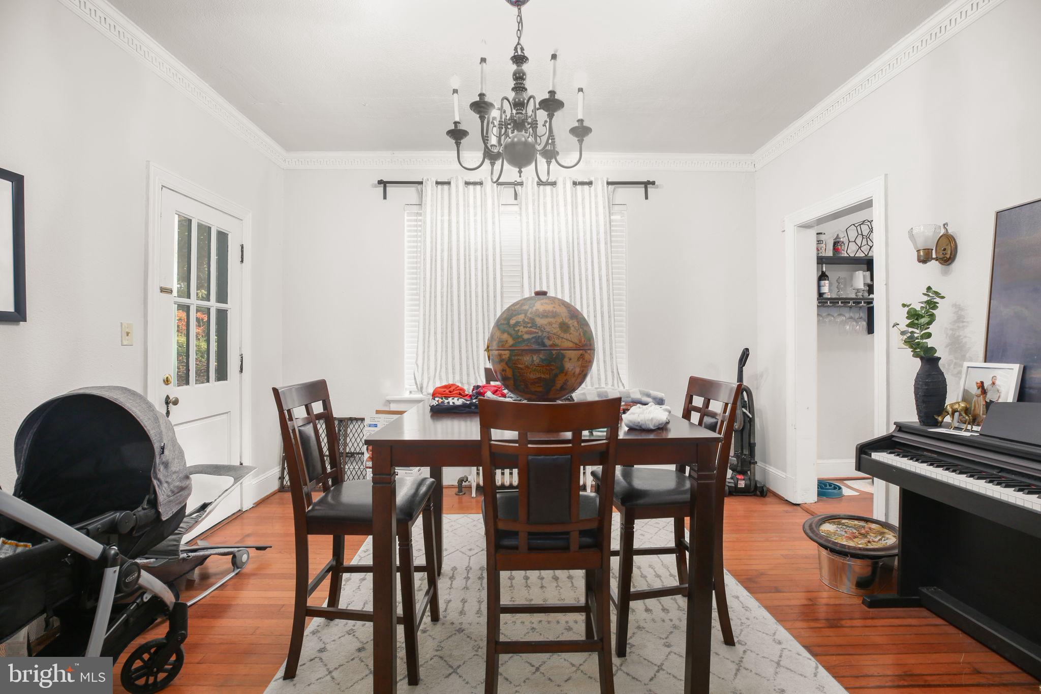 1717 Highland Road Fredericksburg, VA 22401 - Photo 8 of 40 a view of a dining room with furniture and chandelier