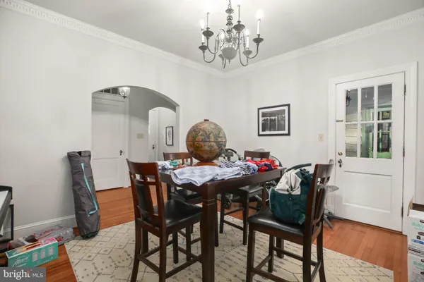 a view of a dining room with furniture and chandelier