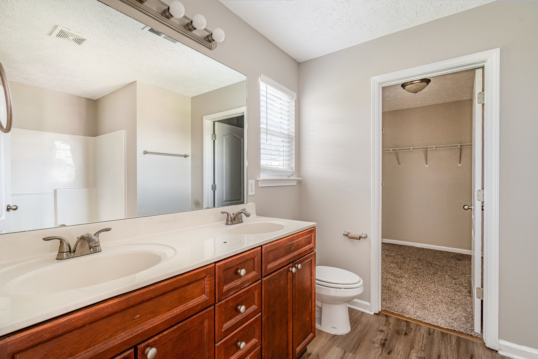 103 Chapel Brook Way Murfreesboro, TN 37129 - Photo 21 of 23 a bathroom with a granite countertop sink toilet a large mirror and shower