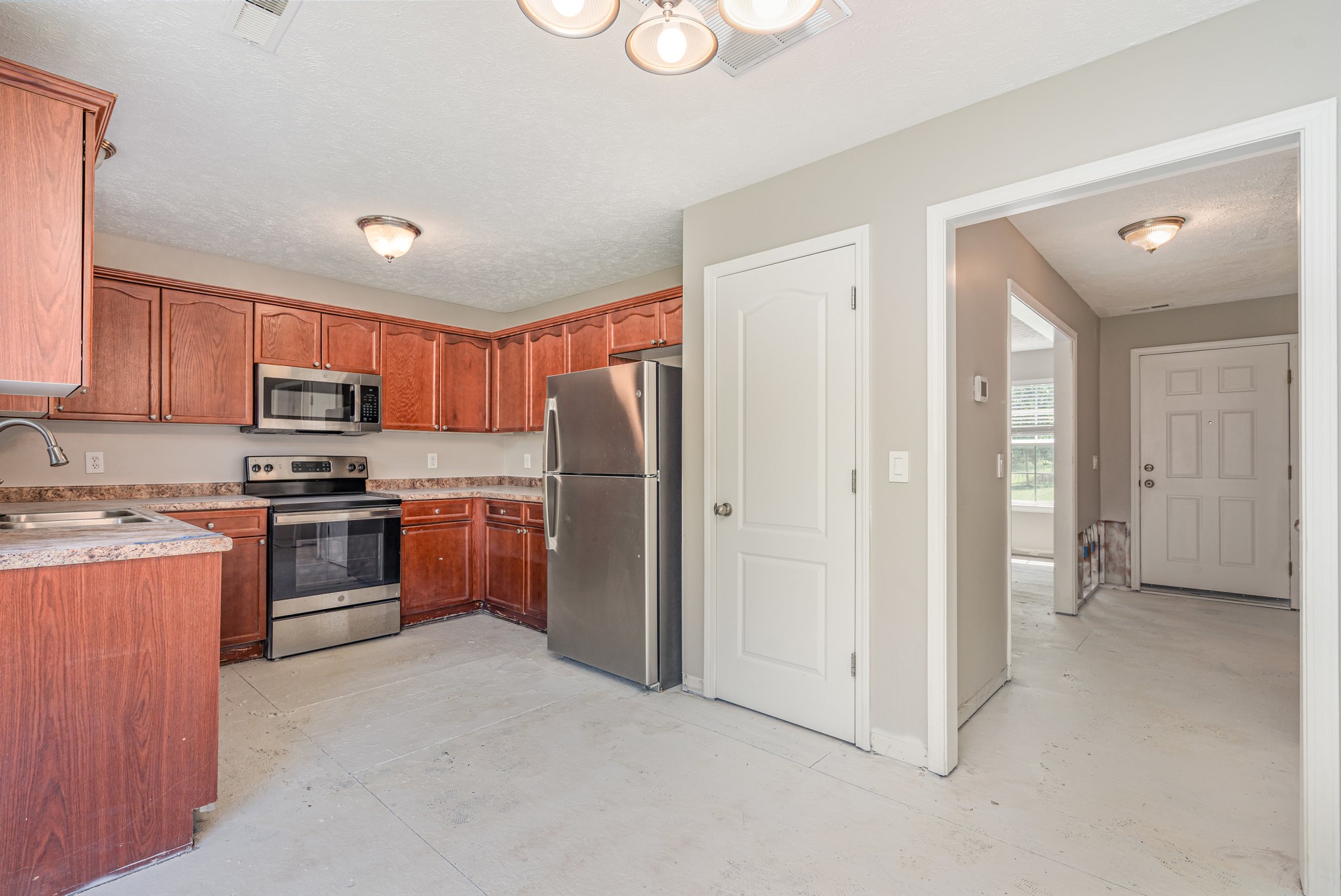 103 Chapel Brook Way Murfreesboro, TN 37129 - Photo 6 of 23 a kitchen with stainless steel appliances granite countertop a refrigerator and a stove top oven