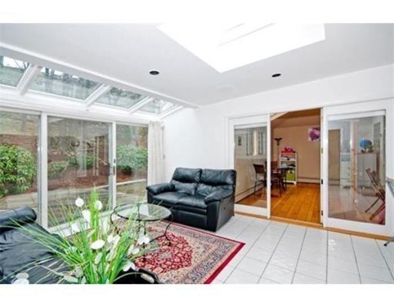 15 Cross Hill Road Newton, MA 02459 - Photo 11 of 25 a living room with furniture and a floor to ceiling window