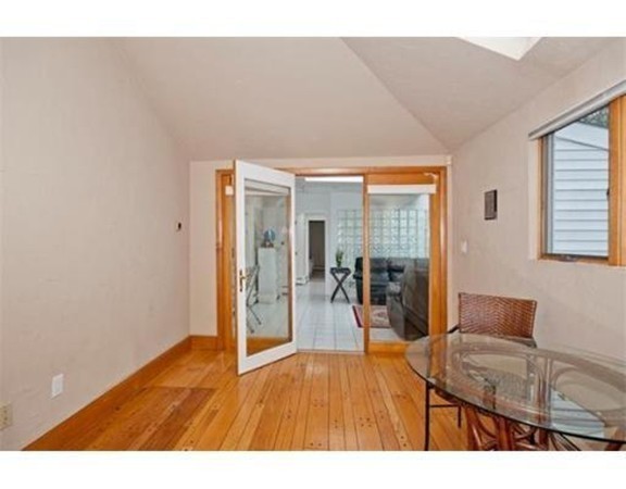 15 Cross Hill Road Newton, MA 02459 - Photo 14 of 25 a room with wooden floor and furniture