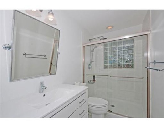 15 Cross Hill Road Newton, MA 02459 - Photo 17 of 25 a bathroom with a sink a toilet and shower