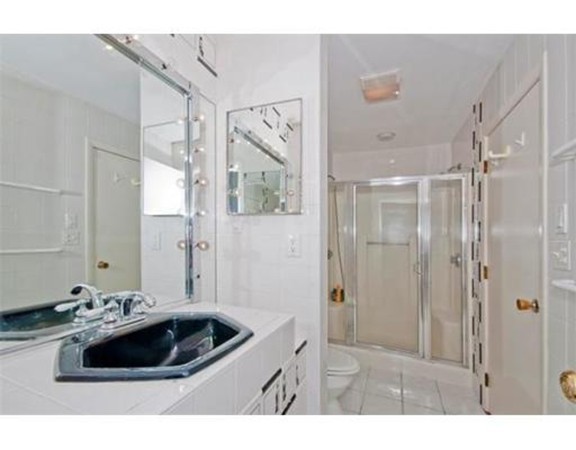 15 Cross Hill Road Newton, MA 02459 - Photo 21 of 25 a bathroom with a sink and a mirror