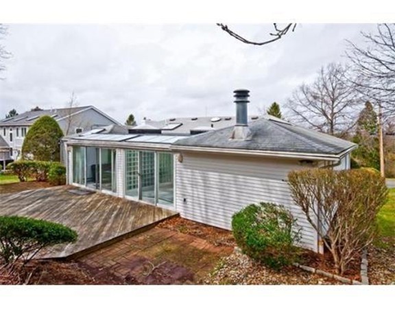 15 Cross Hill Road Newton, MA 02459 - Photo 24 of 25 a view of a house with a backyard