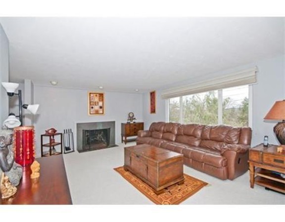 15 Cross Hill Road Newton, MA 02459 - Photo 3 of 25 a living room with furniture and a fireplace