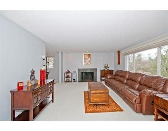 15 Cross Hill Road Newton, MA 02459 - Photo 4 of 25 a living room with furniture and a fireplace