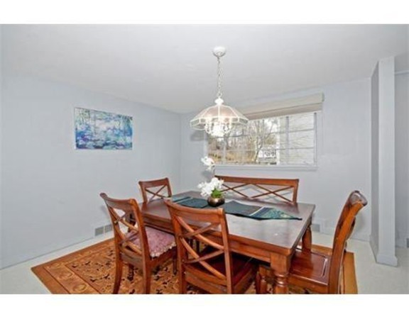 15 Cross Hill Road Newton, MA 02459 - Photo 6 of 25 a view of a dining room with furniture a chandelier and wooden floor