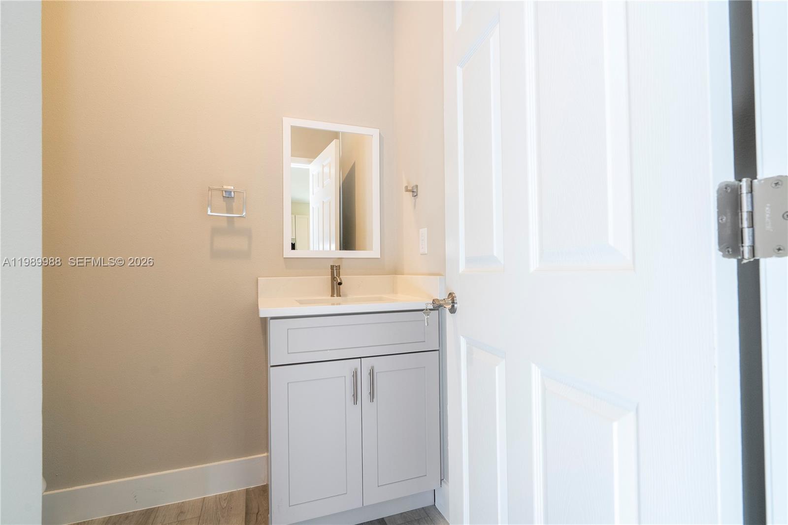 7916 Granada Road Sebring, FL 33876 - Photo 26 of 60 a bathroom with a sink and a mirror