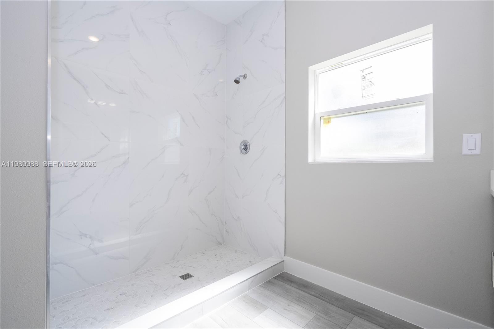 7916 Granada Road Sebring, FL 33876 - Photo 47 of 60 a bathroom with a window