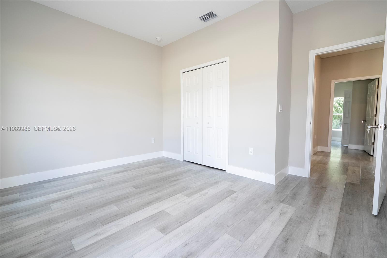 7916 Granada Road Sebring, FL 33876 - Photo 52 of 60 a view of a room with wooden floor