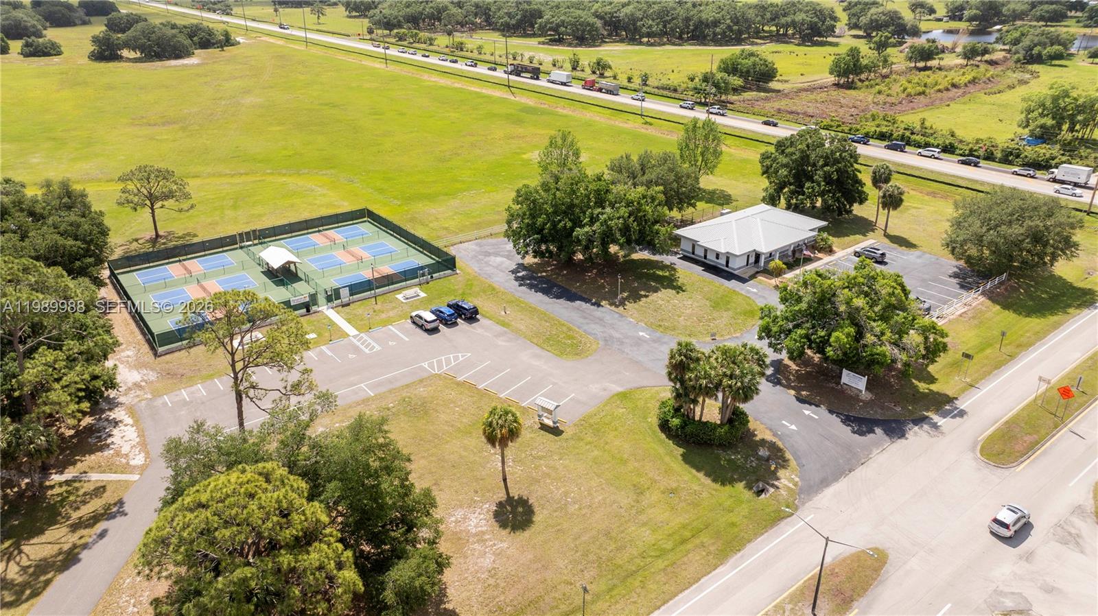 7916 Granada Road Sebring, FL 33876 - Photo 58 of 60 an aerial view of residential houses with outdoor space