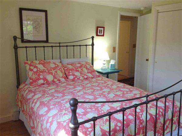 58 Doane Road Chatham, MA 02633 - Photo 12 of 24 a bed sitting in a bedroom next to a window