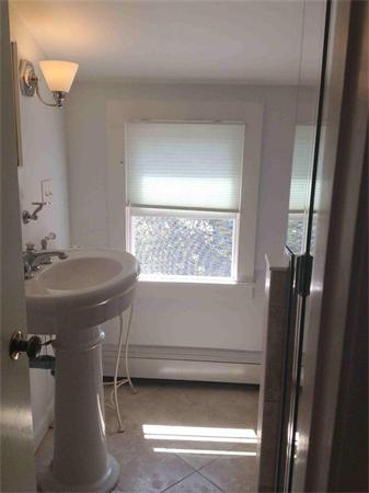 58 Doane Road Chatham, MA 02633 - Photo 16 of 24 a bathroom with a sink and a mirror