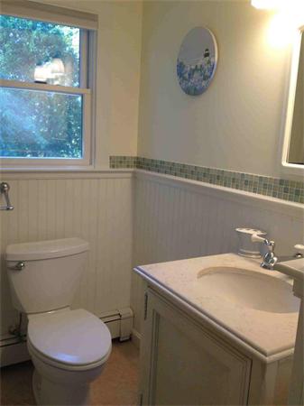 58 Doane Road Chatham, MA 02633 - Photo 17 of 24 a bathroom with a toilet a sink and a mirror
