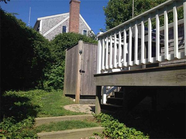 58 Doane Road Chatham, MA 02633 - Photo 21 of 24 a front view of a house with garden