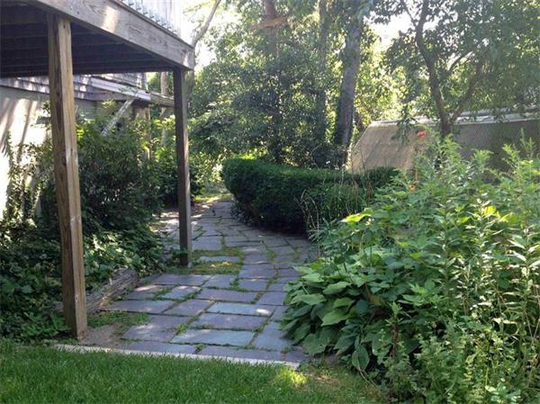 58 Doane Road Chatham, MA 02633 - Photo 22 of 24 a view of a backyard with garden
