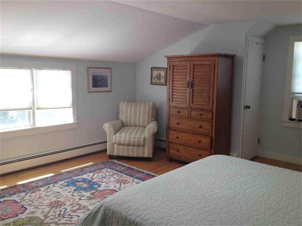 58 Doane Road Chatham, MA 02633 - Photo 9 of 24 a bedroom with a bed and a window