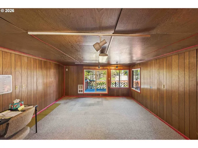 a view of livingroom with furniture and windows