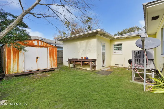 a view of a field with trees