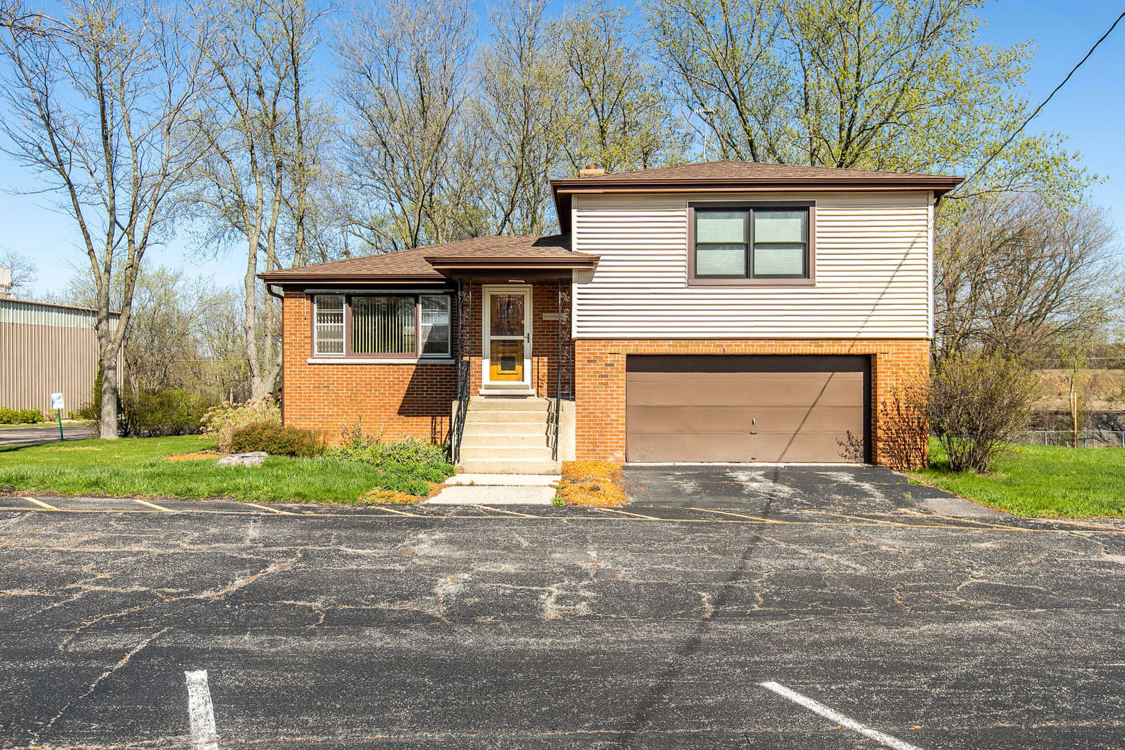 1275 Main Street Antioch, IL 60002 - Photo 21 of 29 a front view of a house with a yard and garage