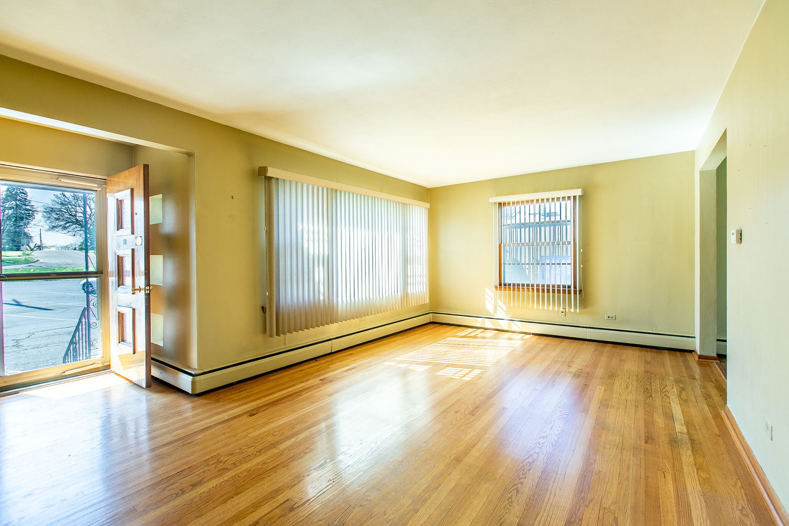 1275 Main Street Antioch, IL 60002 - Photo 22 of 29 a view of an empty room with glass door and wooden floor