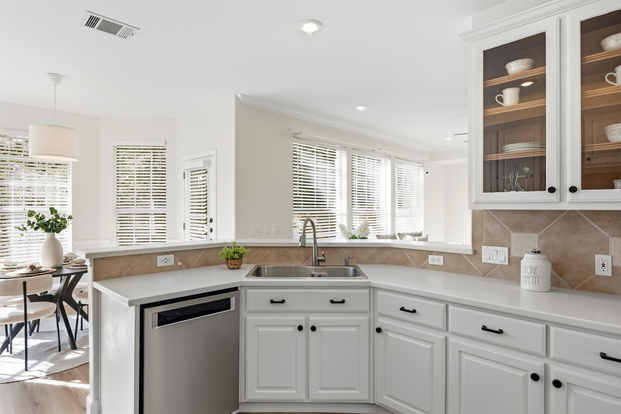 9400 Savannah Ridge Drive Austin, TX 78726 - Photo 18 of 35 a kitchen with granite countertop a sink stove and cabinets