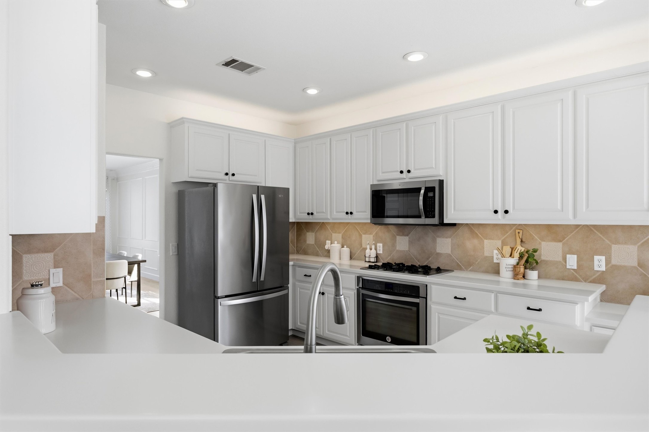 9400 Savannah Ridge Drive Austin, TX 78726 - Photo 19 of 35 a kitchen with stainless steel appliances granite countertop a refrigerator and a stove