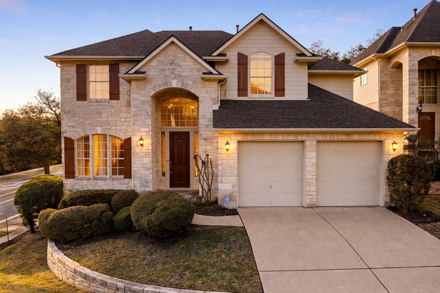 9400 Savannah Ridge Drive Austin, TX 78726 - Photo 2 of 35 a view of a house with large windows and a yard